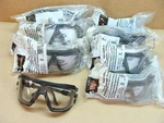 New Lot Of 8 Aosafety Glasses Dust Goggles Motorcycle Style Medium. Fixed Price $30.00.