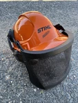 Stihl Woodcutter Safety Helmet W/ Mesh Face Shield & Ear Protection. Fixed Price $80.00.